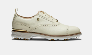 cream colored footjoy spiked players shoes