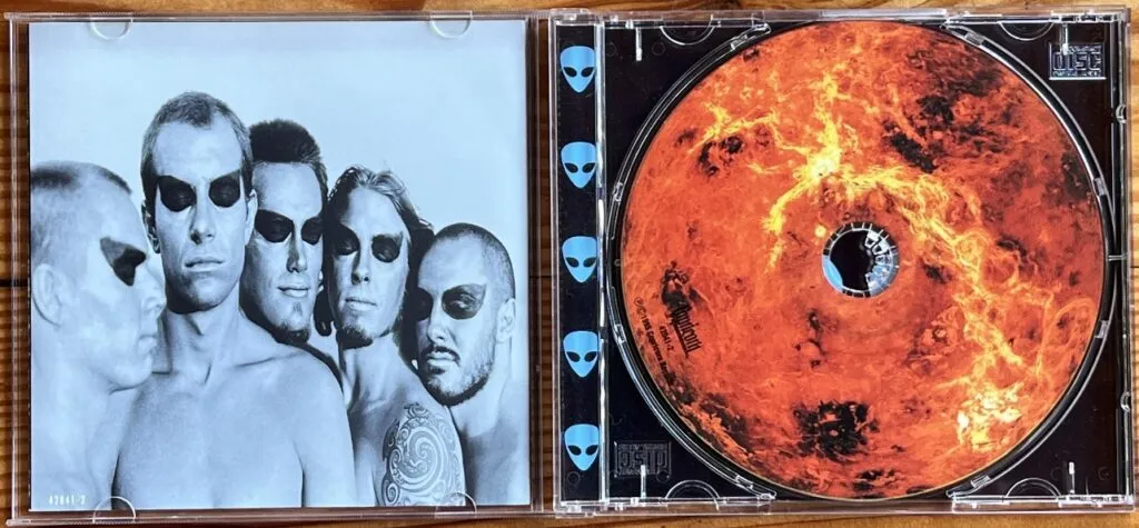 The inside cover & CD of 311's self-titled third studio album also known as the Blue Album