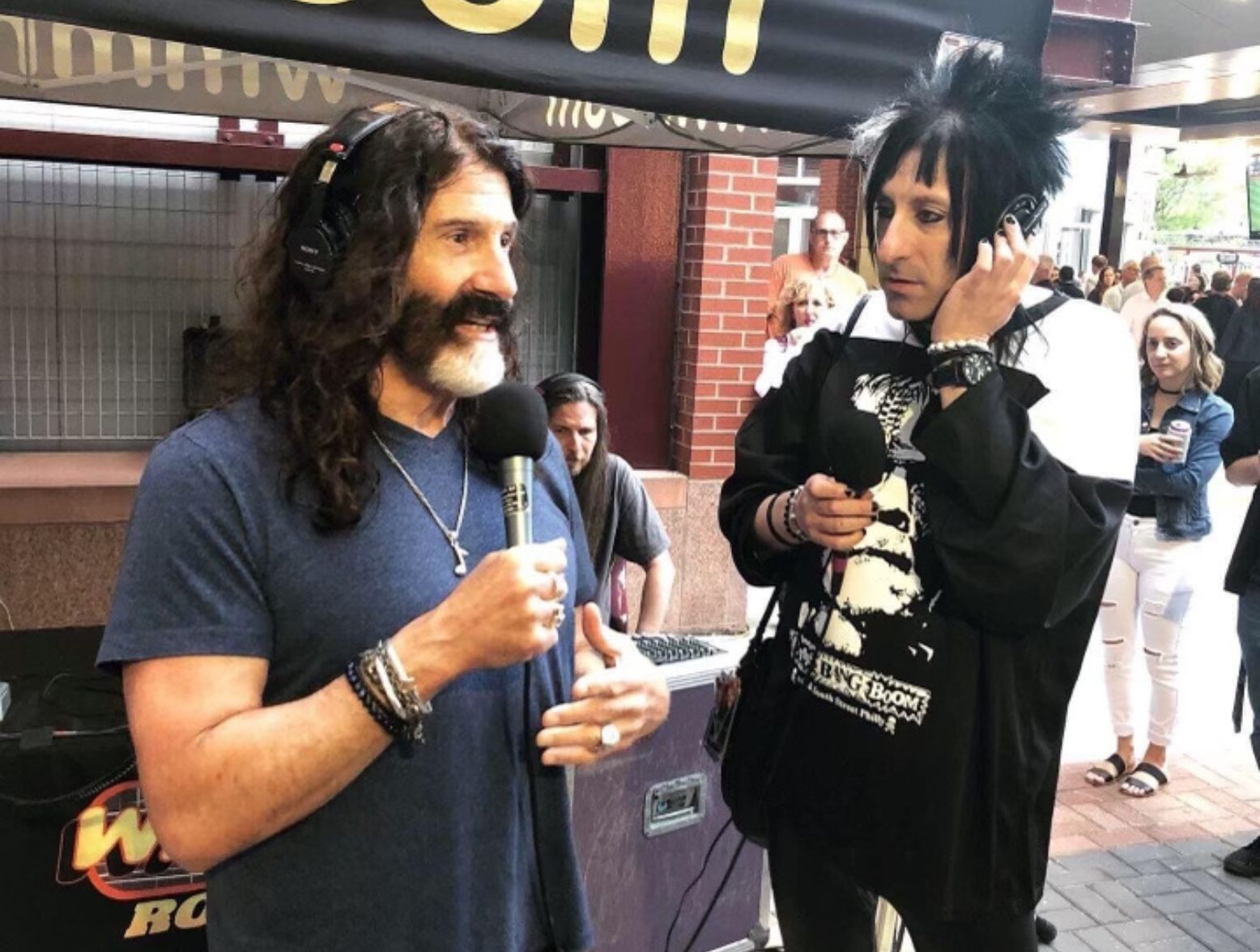 Pierre Robert and JACKY BAMBAM wearing a crash bang boom shirt