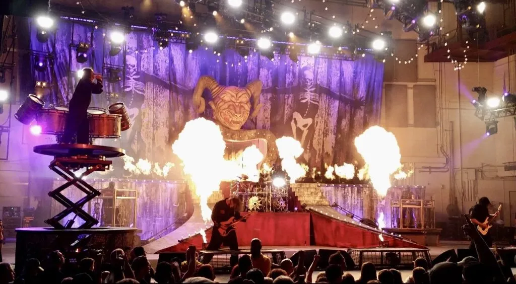Slipknot performing live on stage at the PNC Bank Arts Center in Holmdel, NJ in 2015.