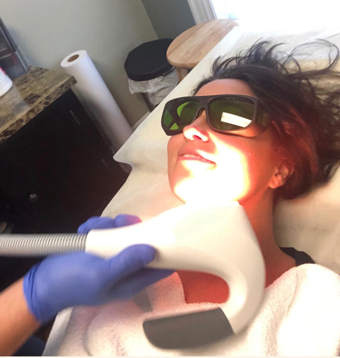 Kathy getting receiving a facial procedure