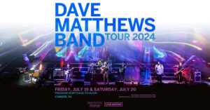 Dave Matthews Band concert poster art featuring a photo of the band on stage in very bright lights.
