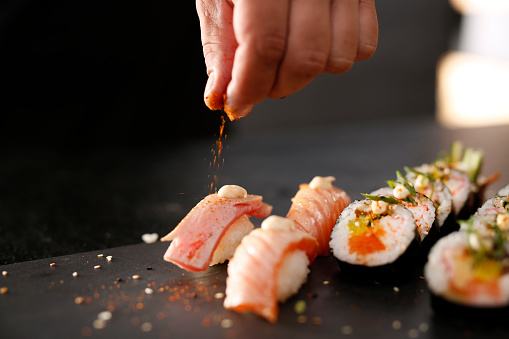 Classic Japanese sushi served on a stone plate. Try an Omakase dining experience.