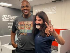 Philadelphia Sixers legend Charles Barkley posing with WMMR DJ Pierre Robert