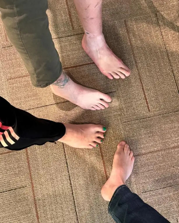 uncensored photo of radio show hosts feet on carpet